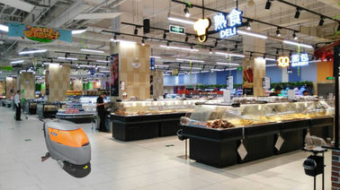 Depurador con pilas del piso del color gris que usa en supermercado y tienda